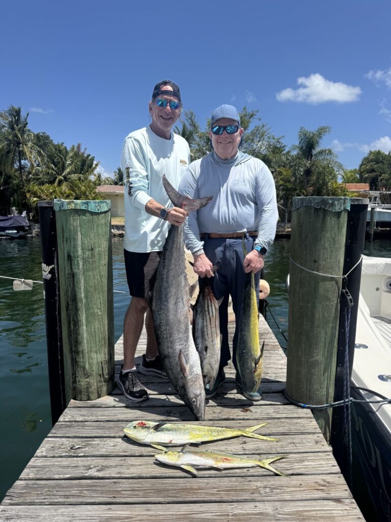 Back at the dock with a today's catch of kingfish and dolphin.
