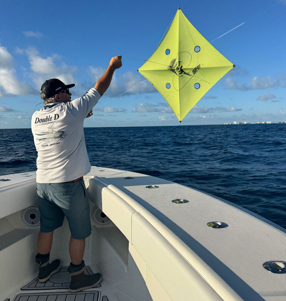 Captain Dean Panos deploying a fishing kite