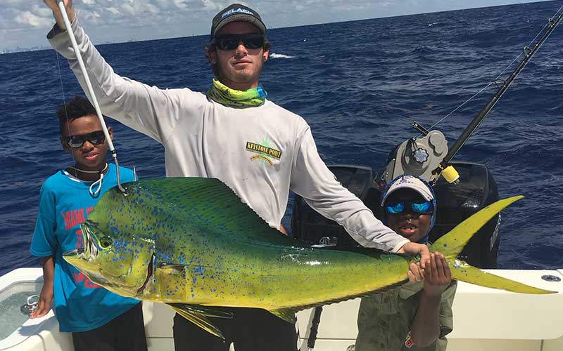 Two young anglers with a beautiful mahi-mahi